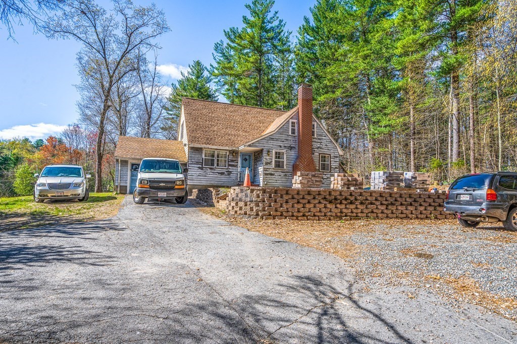 89 Willow Road Boxford, MA 01921 - Photo 15 of 22 a view of a house with cars parked in front of house