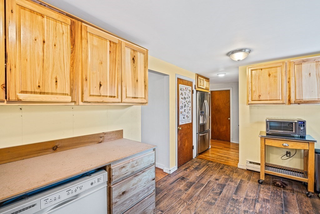 89 Willow Road Boxford, MA 01921 - Photo 2 of 22 a kitchen with stainless steel appliances granite countertop a refrigerator and a stove top oven