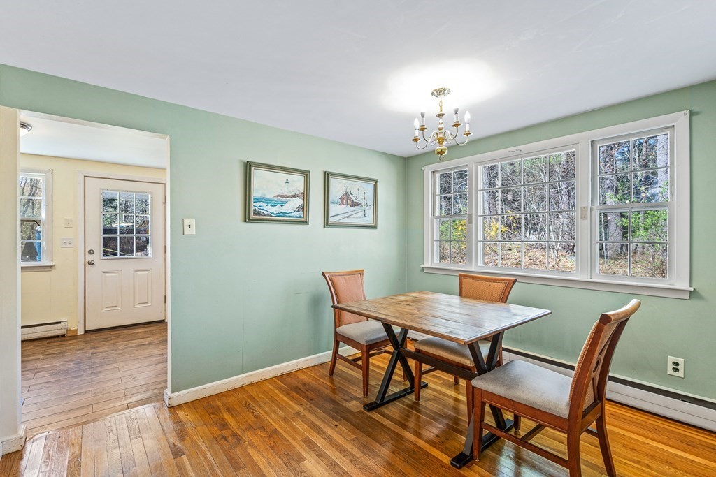 89 Willow Road Boxford, MA 01921 - Photo 3 of 22 a view of a dining room with furniture window and wooden floor