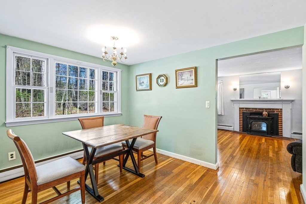 89 Willow Road Boxford, MA 01921 - Photo 4 of 22 a view of a livingroom with furniture and a fireplace