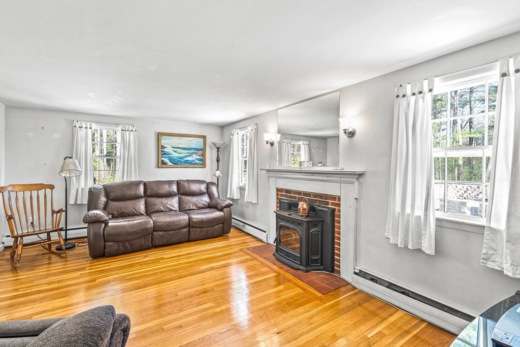 89 Willow Road Boxford, MA 01921 - Photo 6 of 22 a living room with furniture and a fireplace