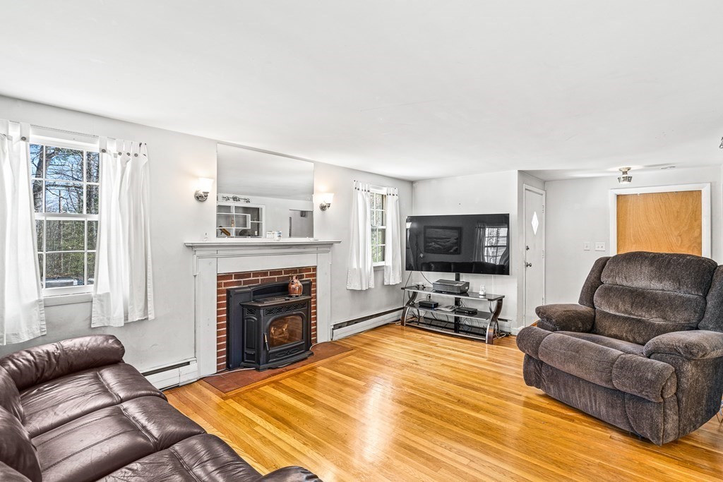 89 Willow Road Boxford, MA 01921 - Photo 8 of 22 a living room with furniture and a fireplace