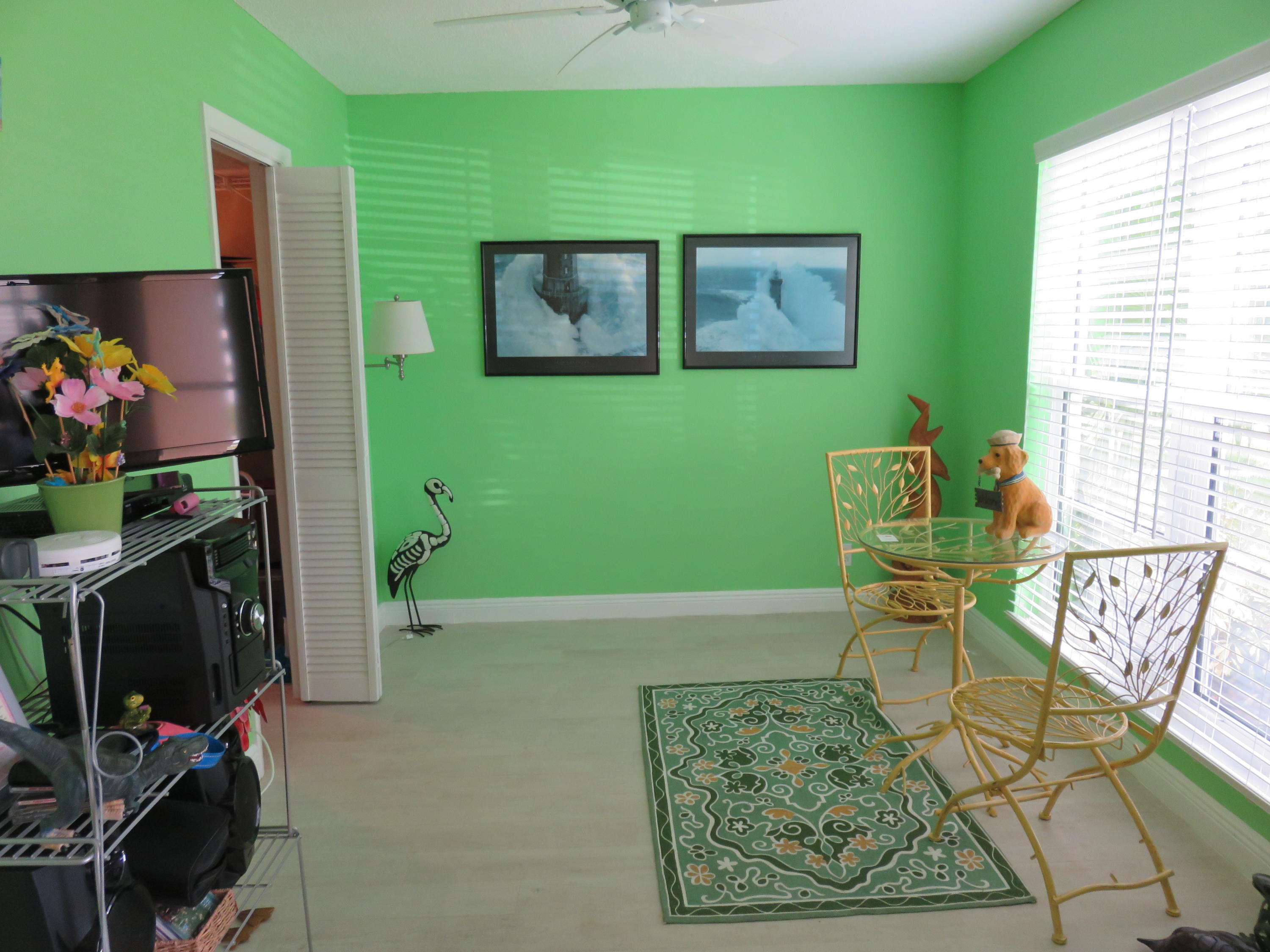 8697 Boca Drive Boca Raton, FL 33433 - Photo 7 of 8 a view of a livingroom with furniture and a potted plant