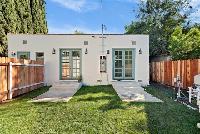a view of a back yard of the house