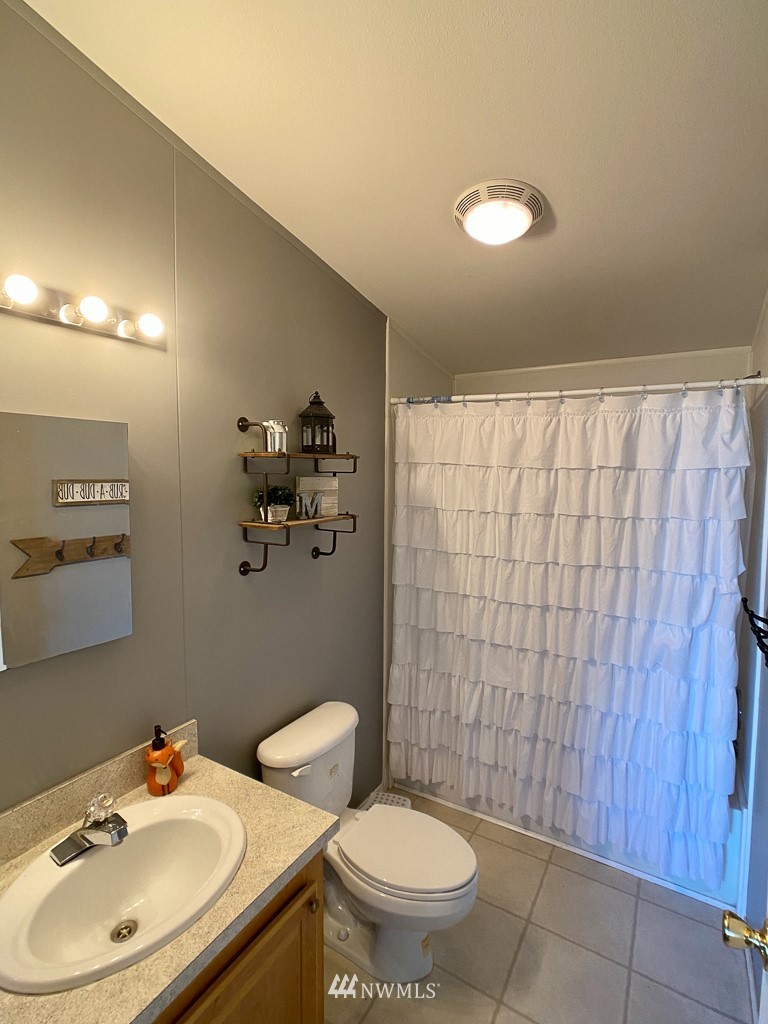 1104 Nooksack Road Nooksack, WA 98276 - Photo 22 of 33 a bathroom with a sink and a mirror