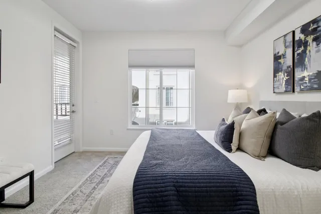 a view of a room with window and a wooden floor