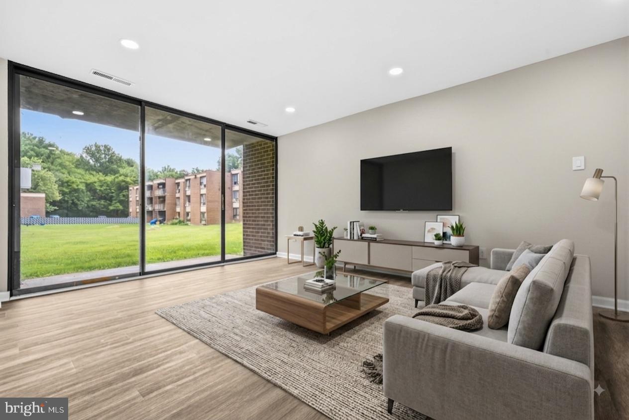 7973 Riggs Road, Unit 1 Hyattsville, MD 20783 - Photo 3 of 24 Bright and airy modern living space.
