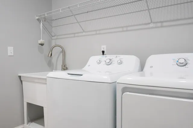 a bedroom with a bed and a dresser in it