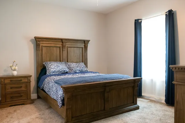 a view of balcony with wooden floor and outdoor seating