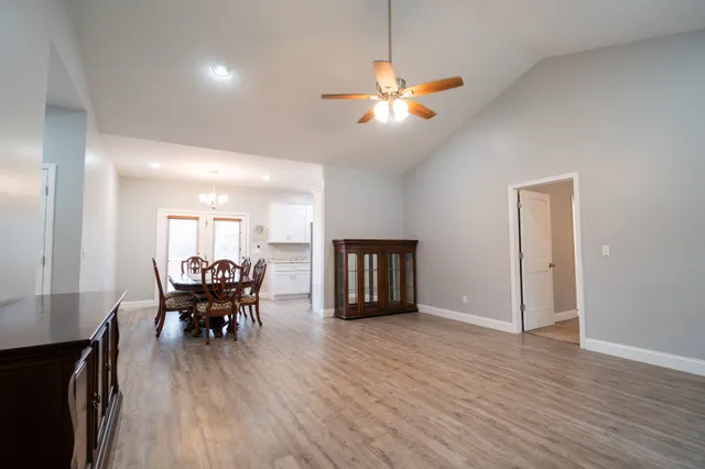 a view of a dining room with furniture and wooden floor