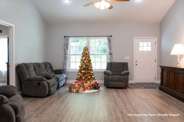 a view of a livingroom with furniture and wooden floor