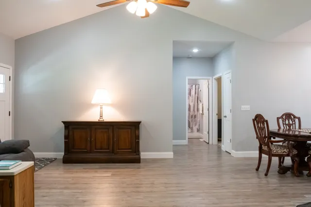 a view of a dining room with furniture and wooden floor