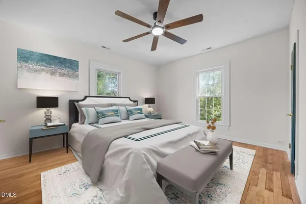 a bedroom with bed and a window