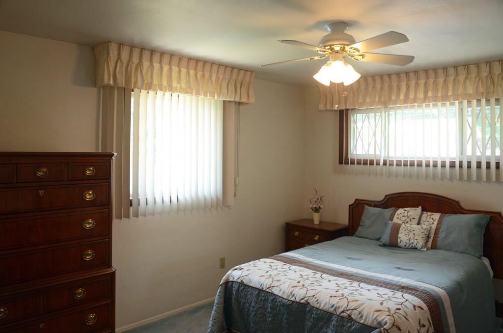 468 Lindsay Road Carnegie, PA 15106 - Photo 11 of 21 Master bedroom which overlooks the front of the home and sideyard. Notice overhead light and ceiling fan.