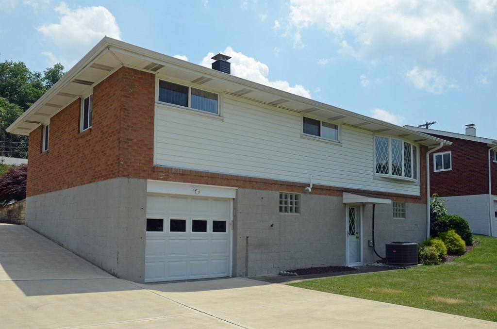 468 Lindsay Road Carnegie, PA 15106 - Photo 21 of 21 Rear view of this adorable ranch home. Newer concrete driveway with a single car garage. Walkout basement door.