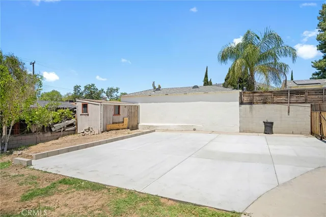 a house with palm tree in front of it