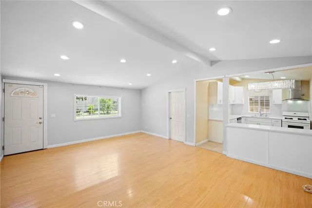 a view of a kitchen with stainless steel appliances a refrigerator