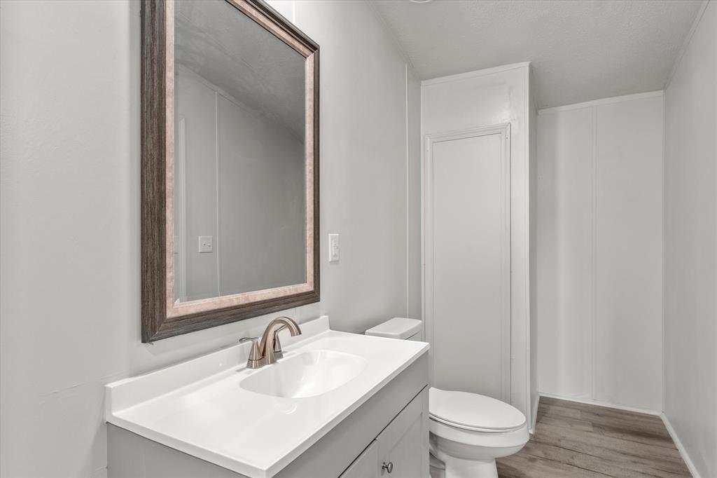 367 Box Road Gun Barrel City, TX 75156 - Photo 17 of 25 a bathroom with a sink toilet and vanity