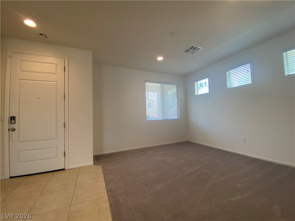 436 Cadence View Way Henderson, NV 89011 - Photo 14 of 36 A welcoming entryway transitions into a spacious, well-lit interior featuring neutral tones.
