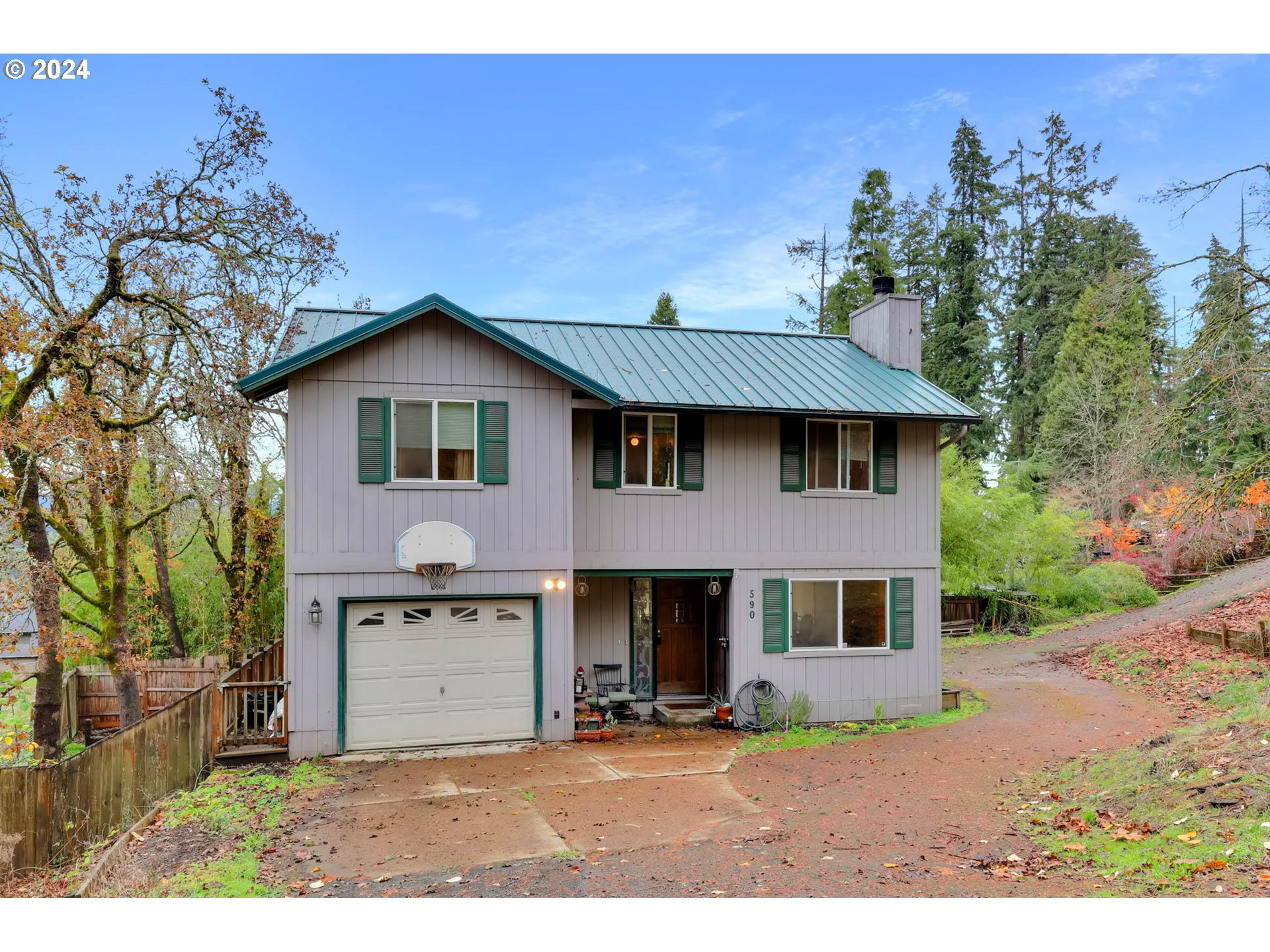 590 South 71st Street Springfield, OR 97478 - Photo 1 of 44 a front view of a house with a garden