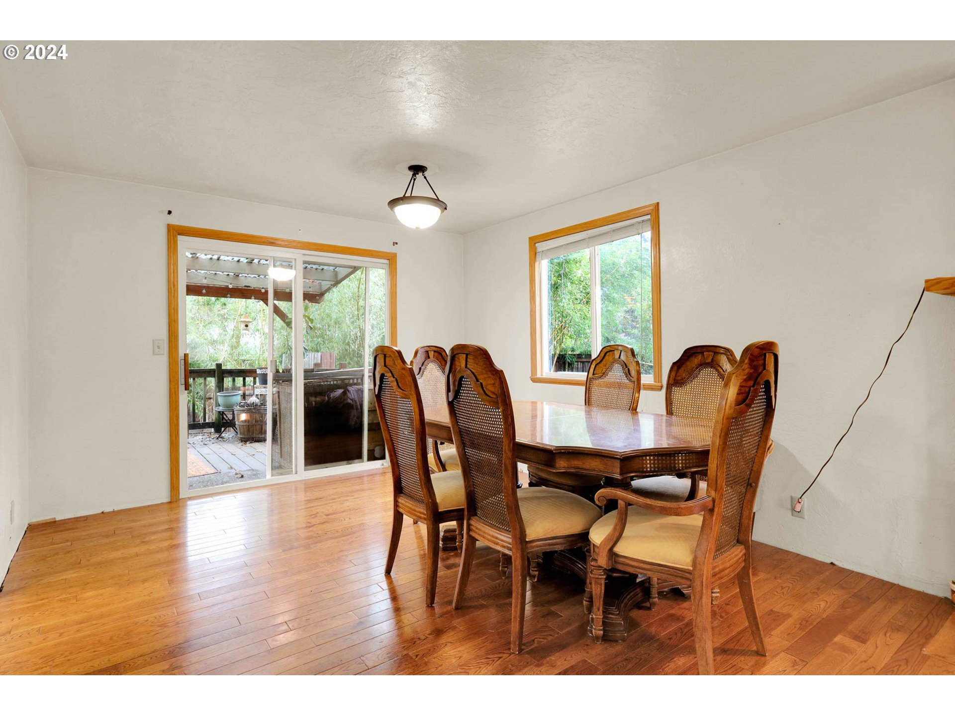 590 South 71st Street Springfield, OR 97478 - Photo 11 of 44 a view of a dining room with furniture window and wooden floor