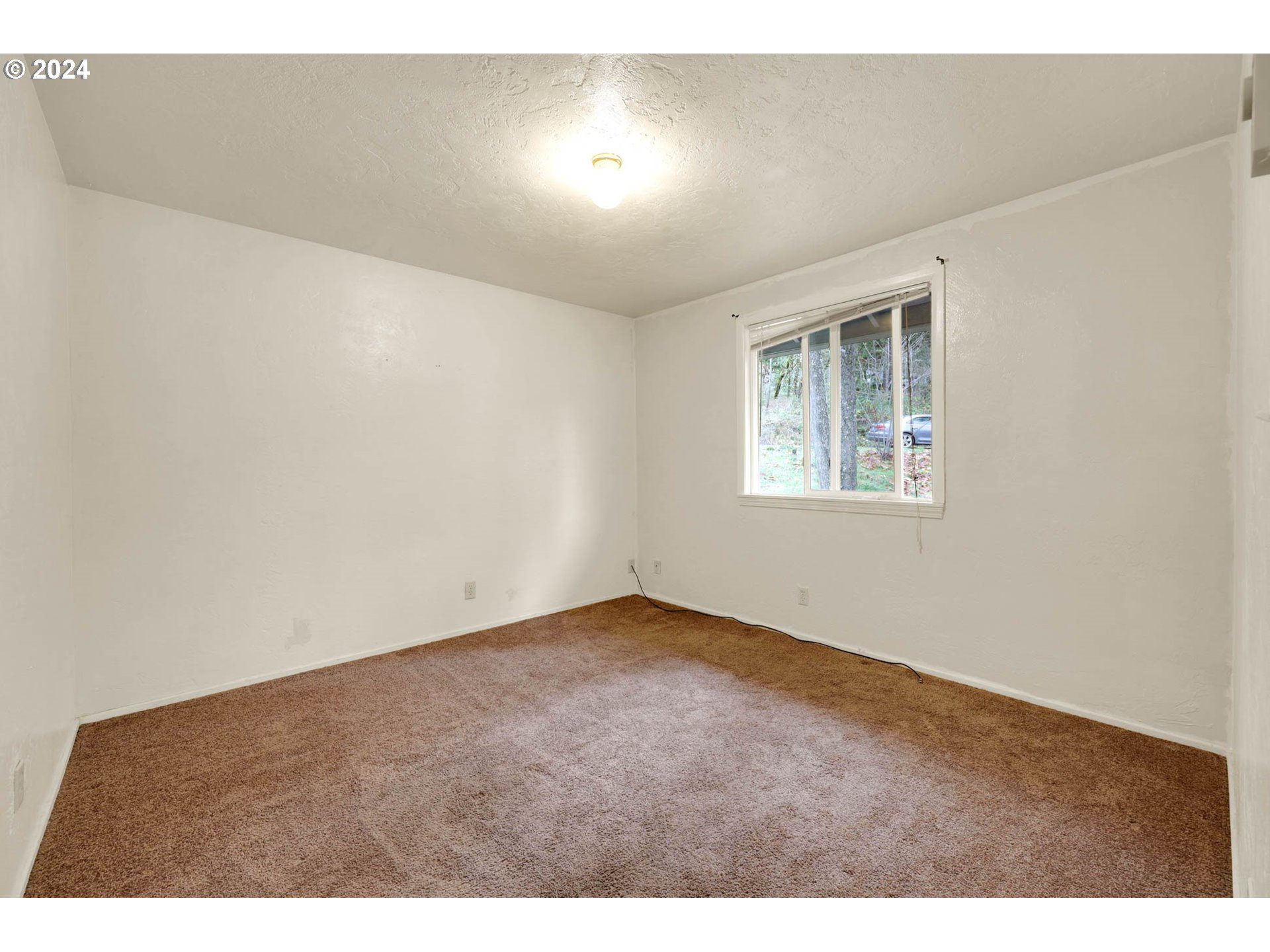 590 South 71st Street Springfield, OR 97478 - Photo 28 of 44 a view of an empty room with a window