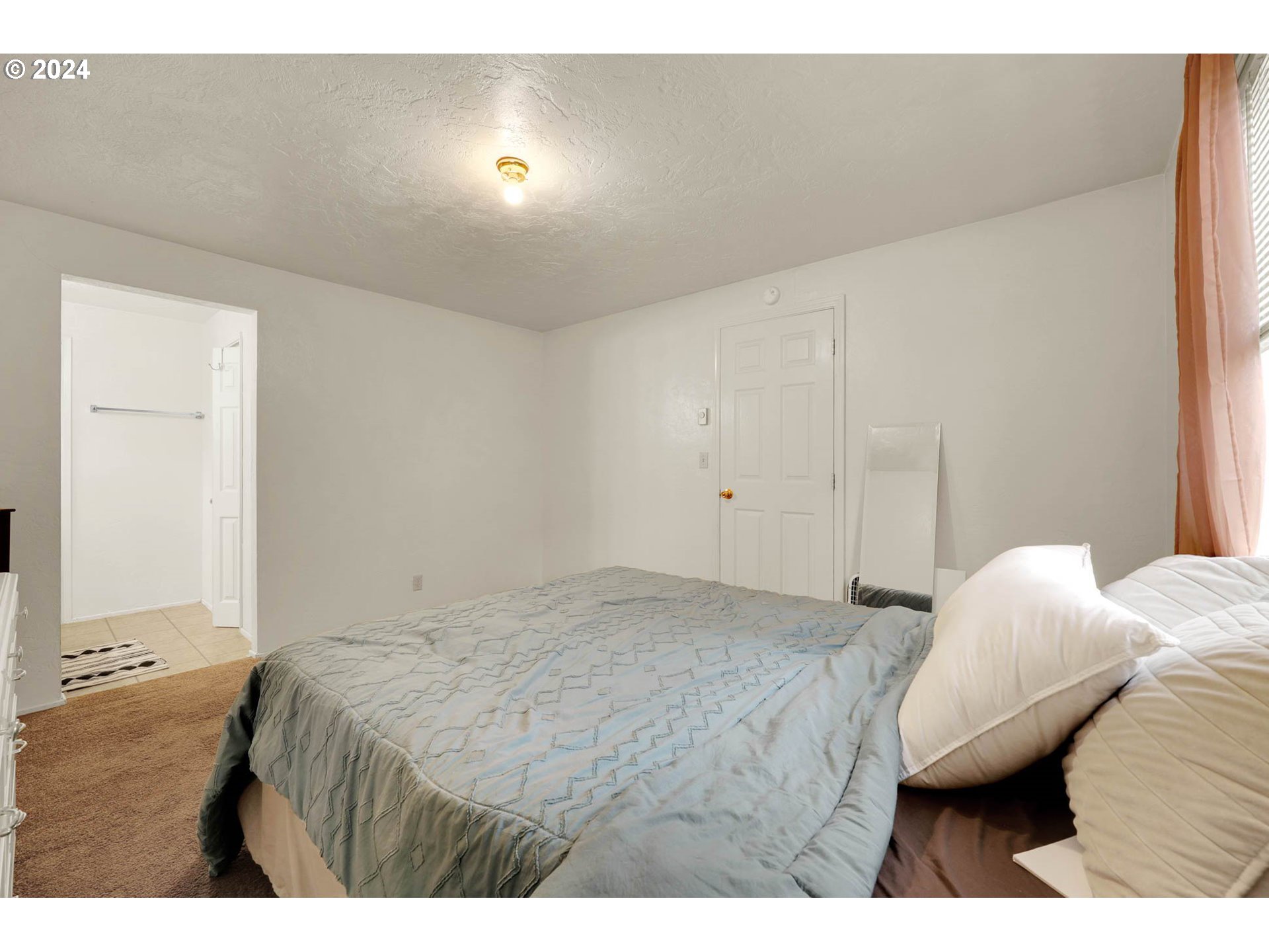 590 South 71st Street Springfield, OR 97478 - Photo 32 of 44 a bed room with a bed and a night stand