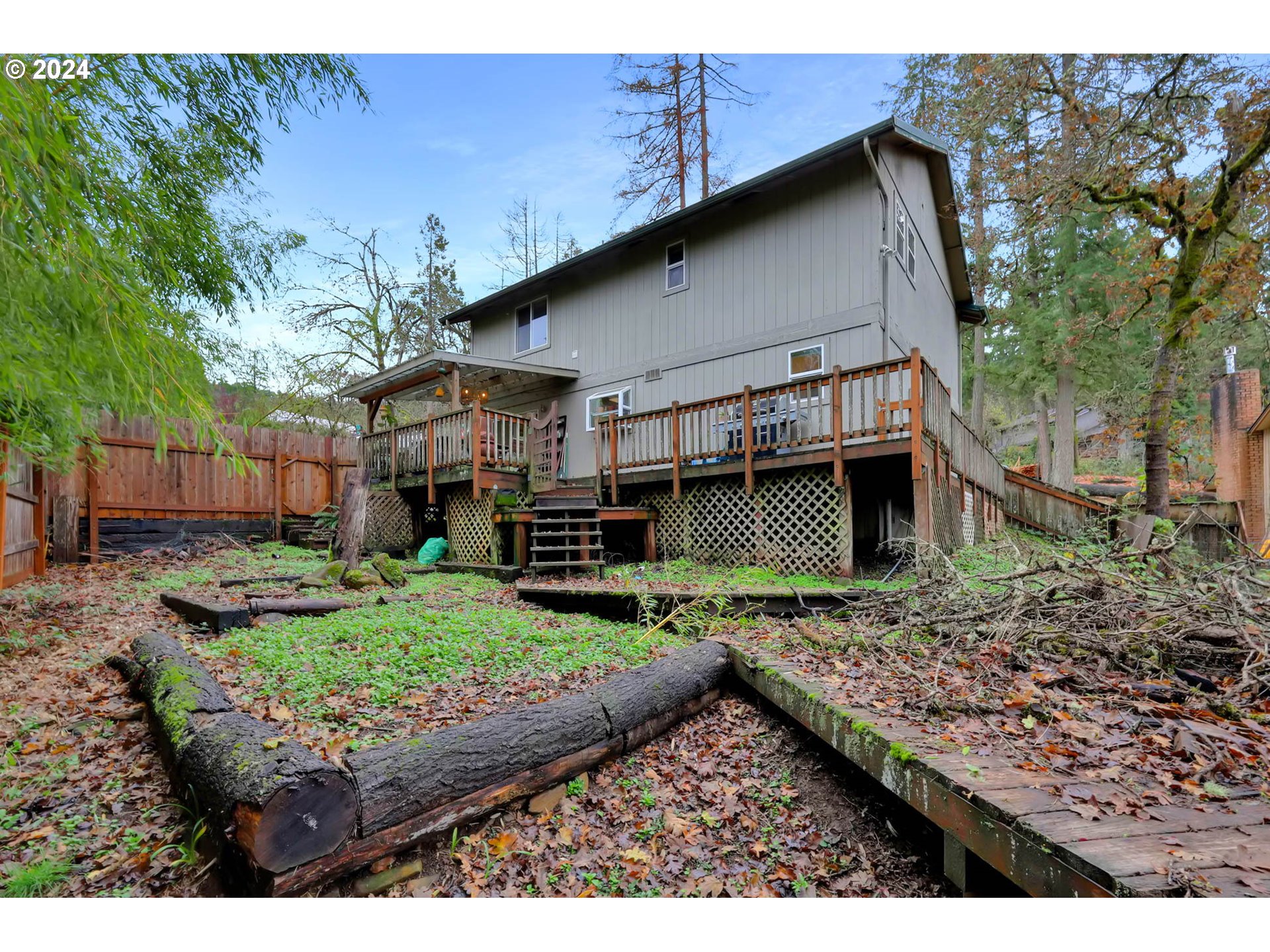 590 South 71st Street Springfield, OR 97478 - Photo 40 of 44 a backyard of a house with a garden and barbeque oven