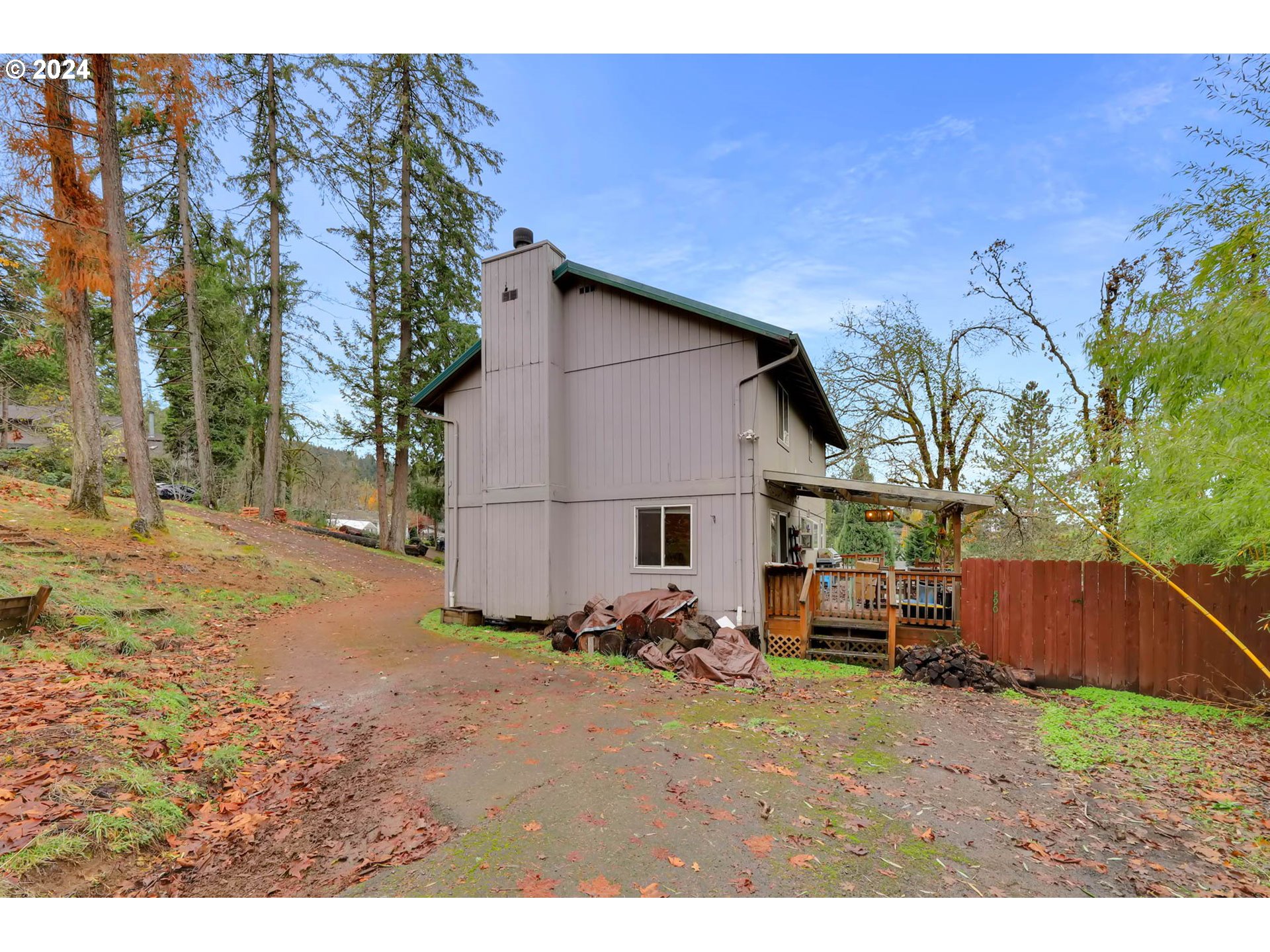 590 South 71st Street Springfield, OR 97478 - Photo 4 of 44 a backyard of a house with barbeque oven and outdoor seating