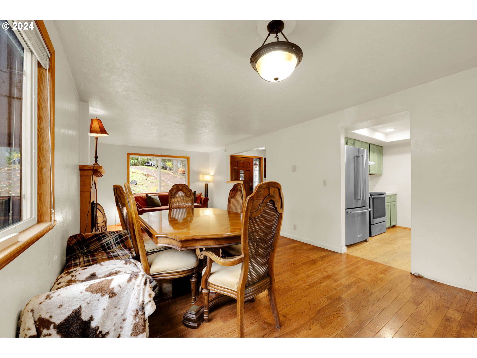 590 South 71st Street Springfield, OR 97478 - Photo 10 of 44 a dining room with furniture and wooden floor