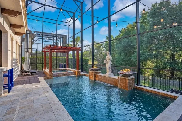a kitchen with stainless steel appliances granite countertop a stove a sink and a dining table