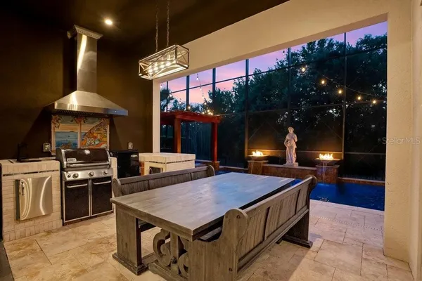 a kitchen with granite countertop a sink stainless steel appliances and cabinets