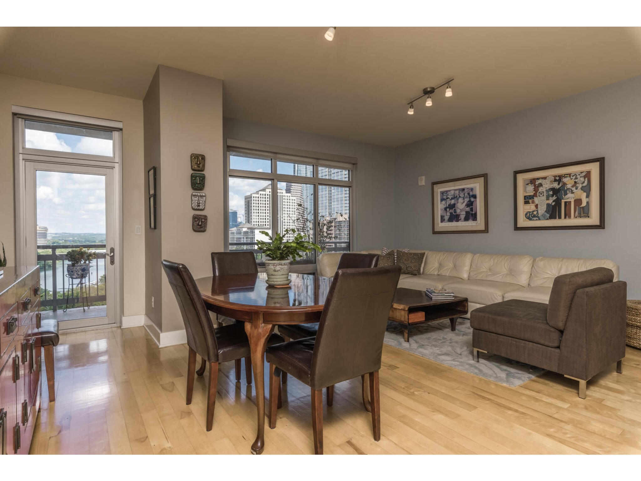 603 Davis Street, Unit 902 Austin, TX 78701 - Photo 5 of 21 Dining room featuring light wood-style flooring, a view of city, and track lighting