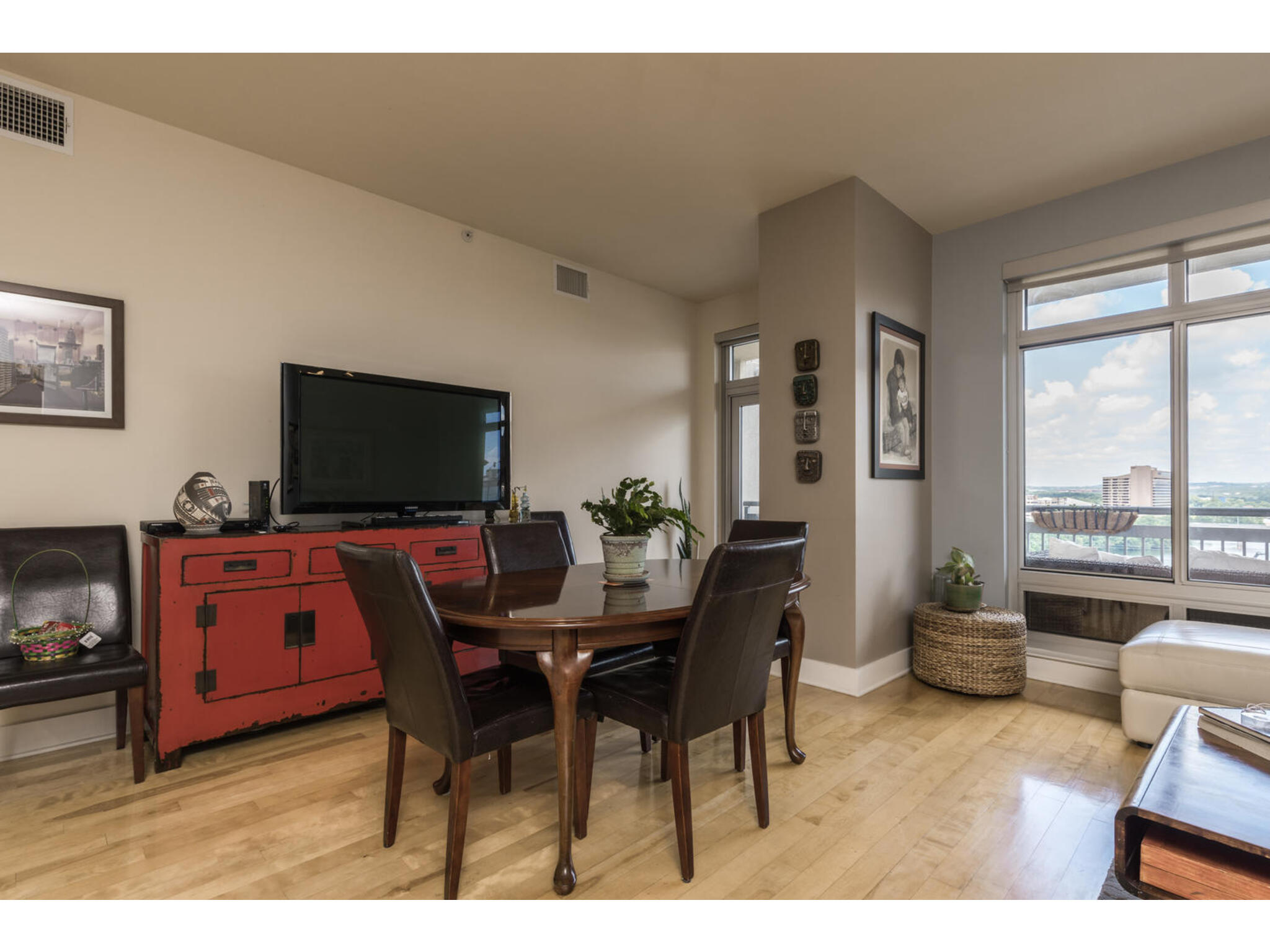 603 Davis Street, Unit 902 Austin, TX 78701 - Photo 6 of 21 Dining space featuring light wood-style flooring and baseboards