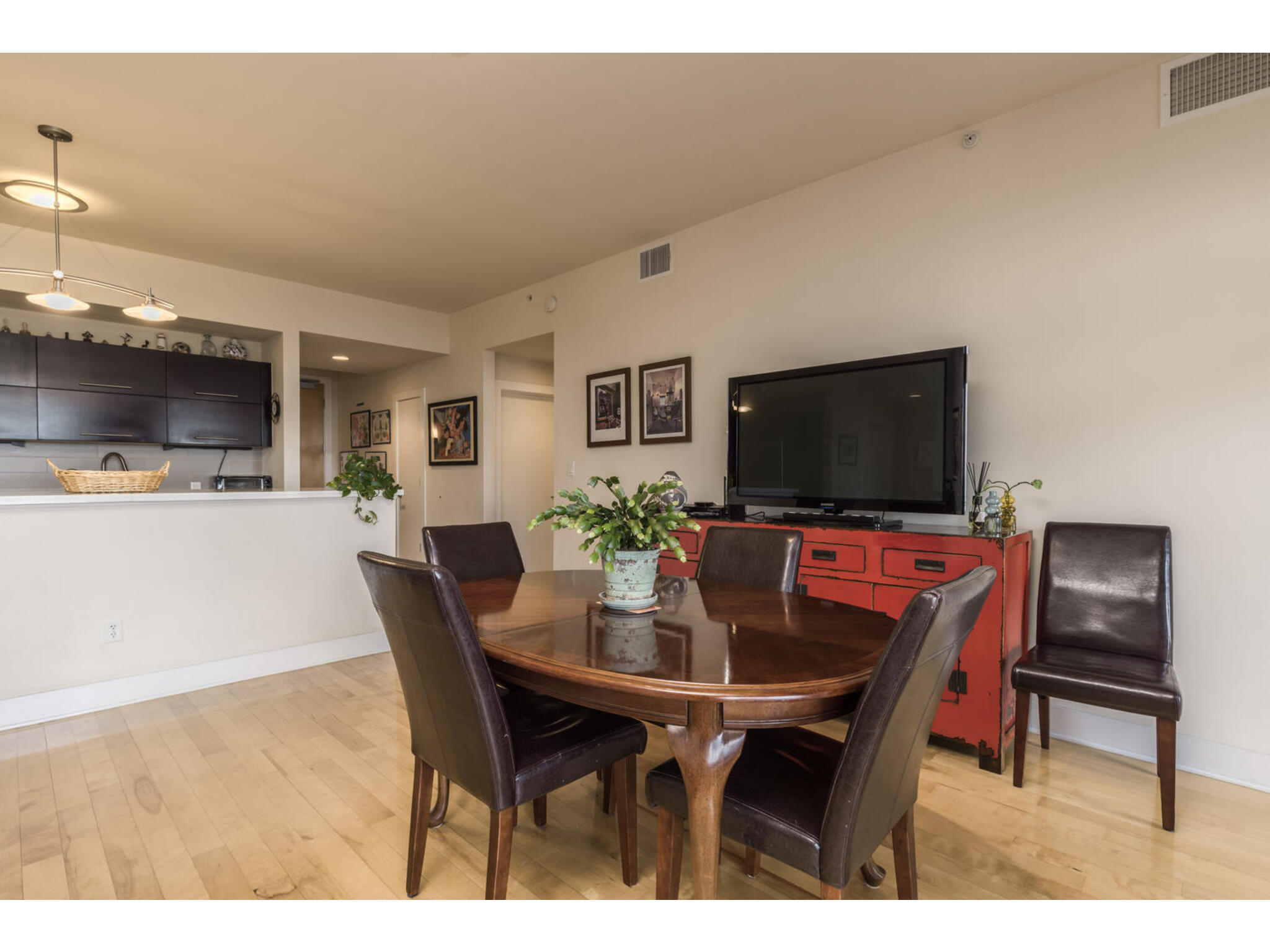 603 Davis Street, Unit 902 Austin, TX 78701 - Photo 7 of 21 Dining space featuring light wood-style floors and baseboards