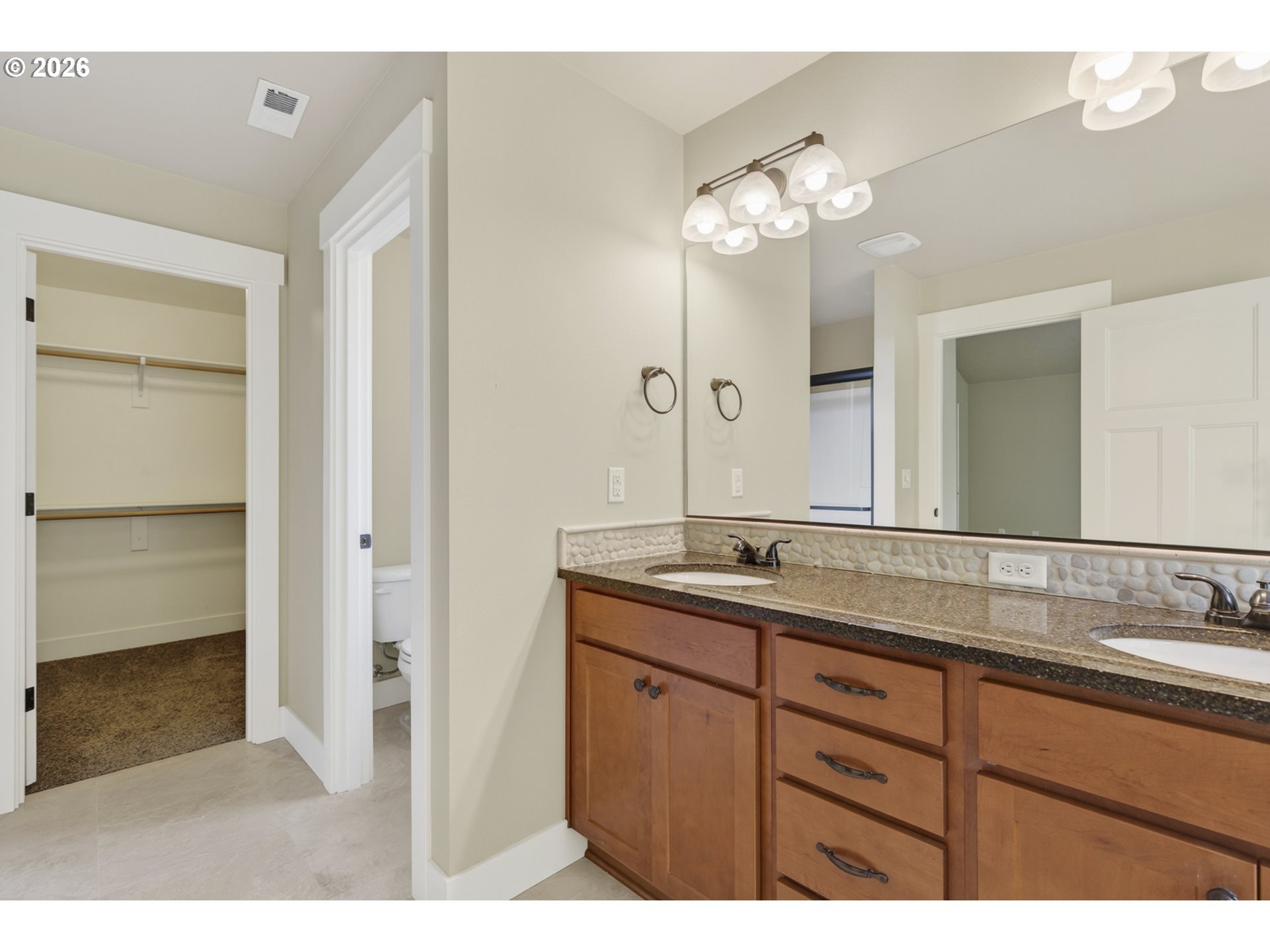 37437 Southeast Olson Street Sandy, OR 97055 - Photo 29 of 48 a bathroom with a granite countertop sink a large mirror and a shower