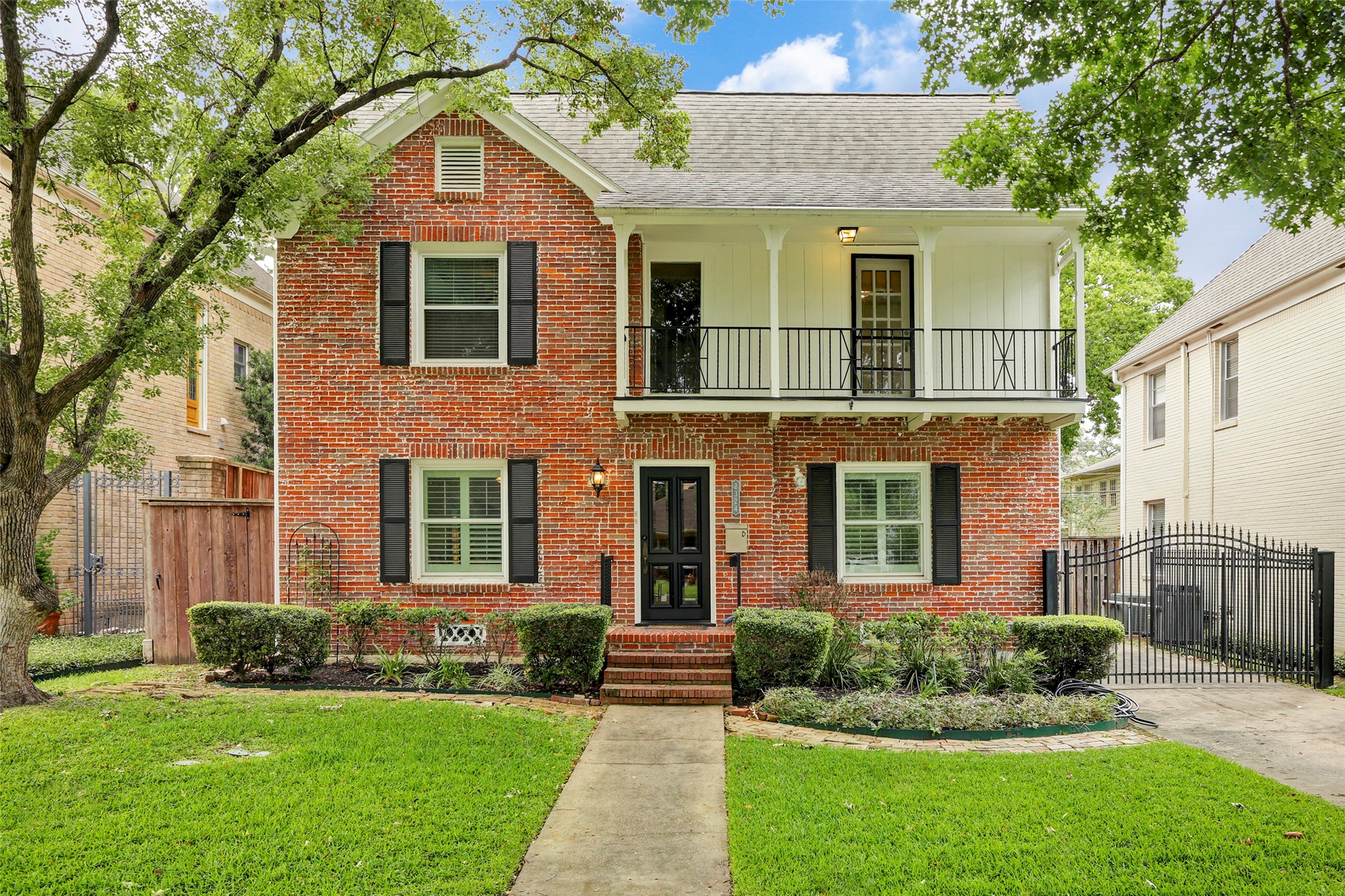 2324 Goldsmith Street, Unit A Houston, TX 77030 - Photo 1 of 30 a front view of a house with a yard and trees