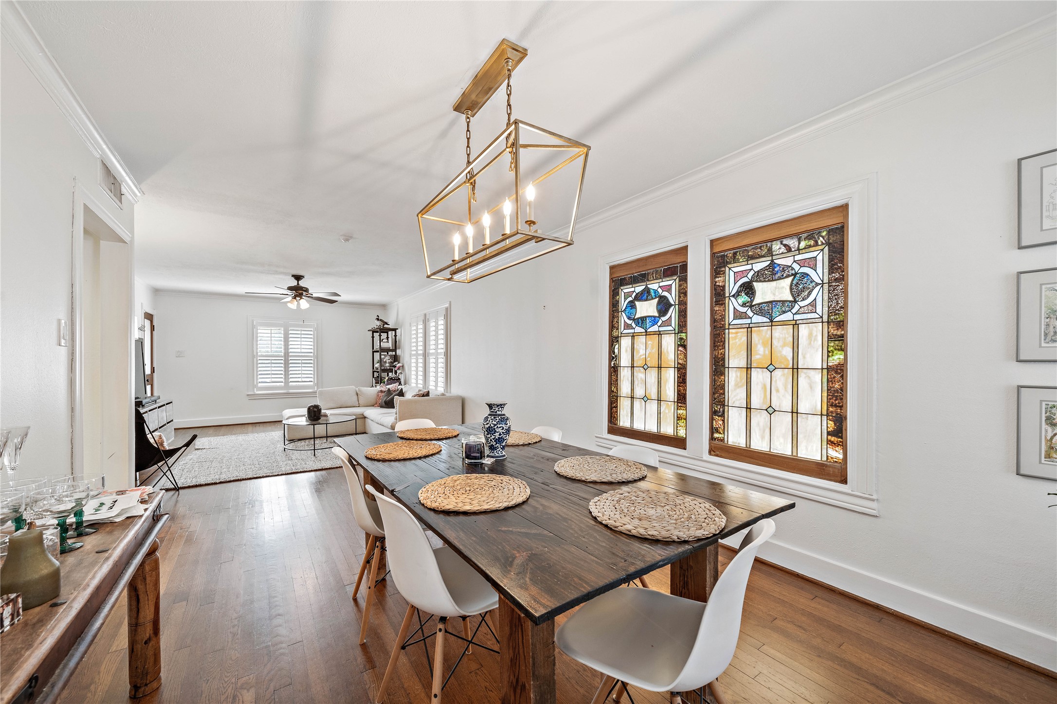 2324 Goldsmith Street, Unit A Houston, TX 77030 - Photo 11 of 30 a view of a dining room and livingroom with furniture wooden floor a chandelier