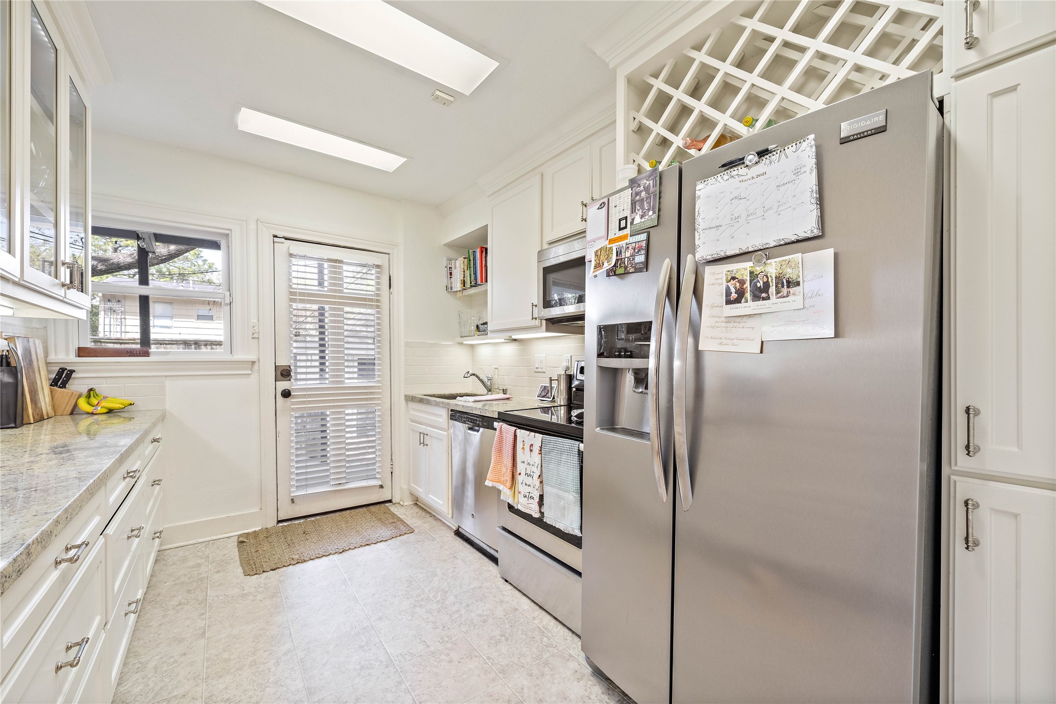2324 Goldsmith Street, Unit A Houston, TX 77030 - Photo 12 of 30 a kitchen with stainless steel appliances granite countertop a refrigerator and a stove