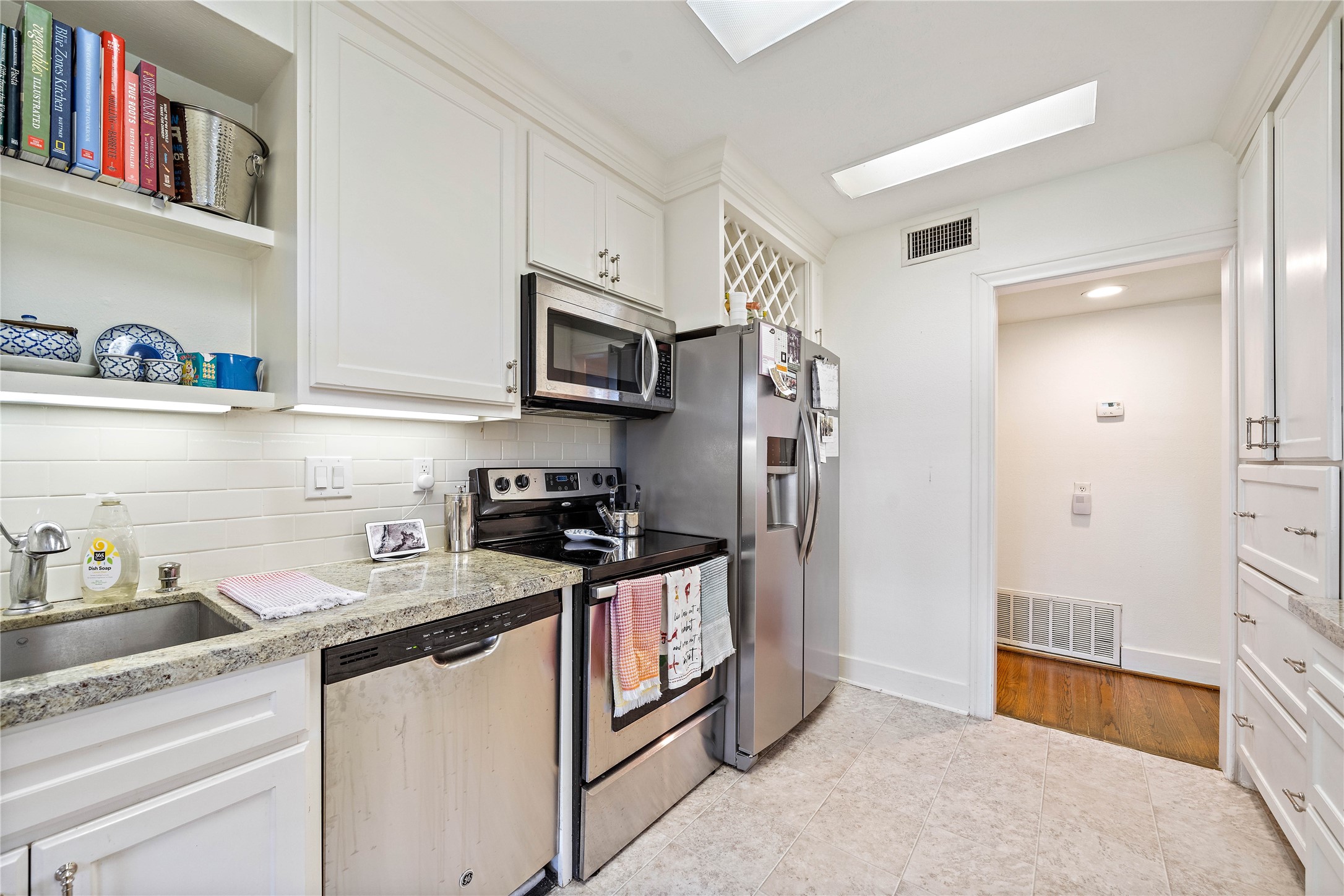 2324 Goldsmith Street, Unit A Houston, TX 77030 - Photo 14 of 30 a kitchen with stainless steel appliances granite countertop a refrigerator and a sink