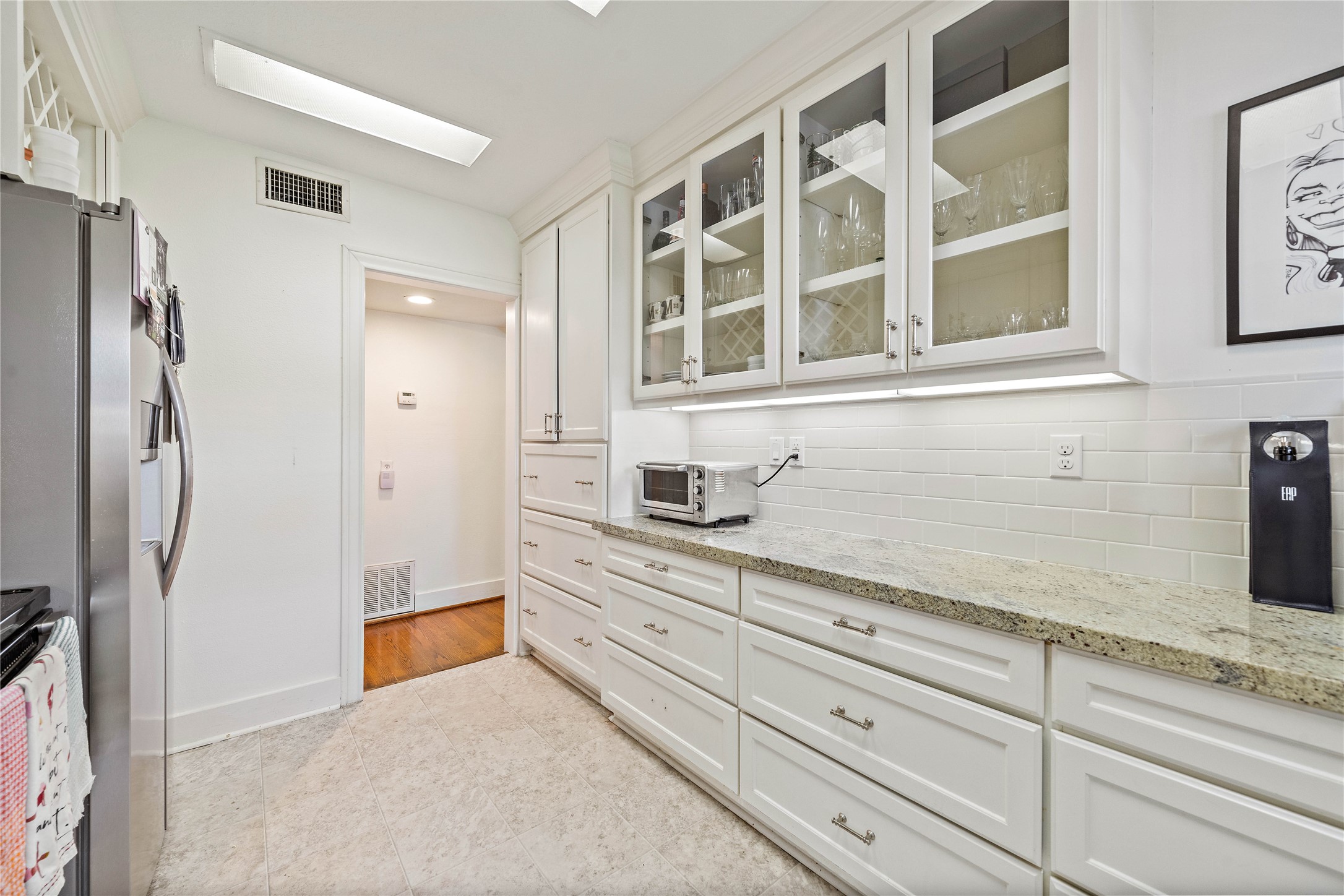 2324 Goldsmith Street, Unit A Houston, TX 77030 - Photo 15 of 30 a bathroom with a granite countertop sink mirror and shower