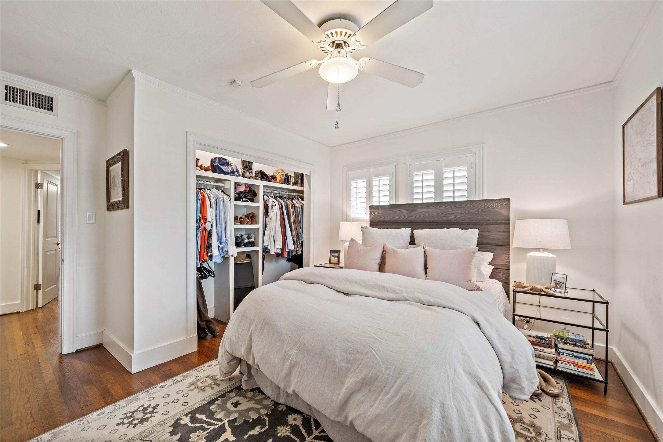 2324 Goldsmith Street, Unit A Houston, TX 77030 - Photo 18 of 30 a bedroom with a bed and a chandelier