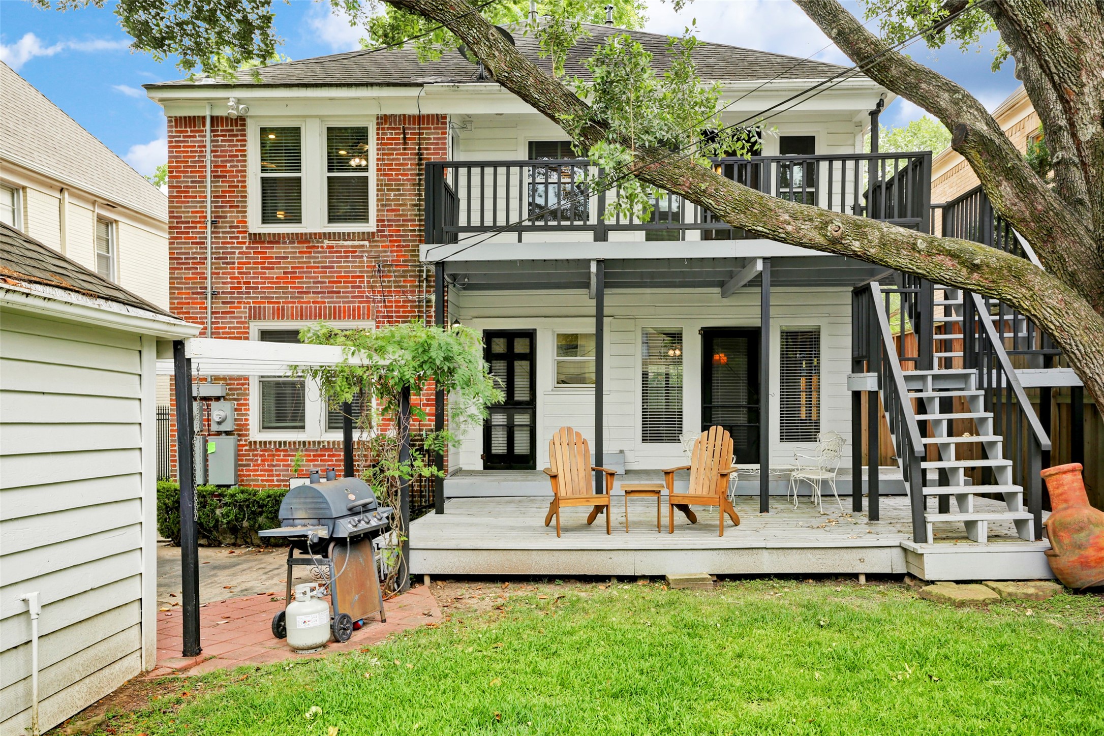 2324 Goldsmith Street, Unit A Houston, TX 77030 - Photo 21 of 30 a view of a house with a yard porch and sitting area