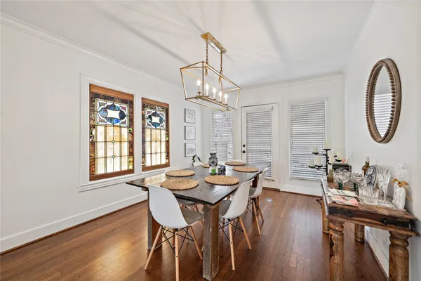 a view of a dining room with furniture window and wooden floor