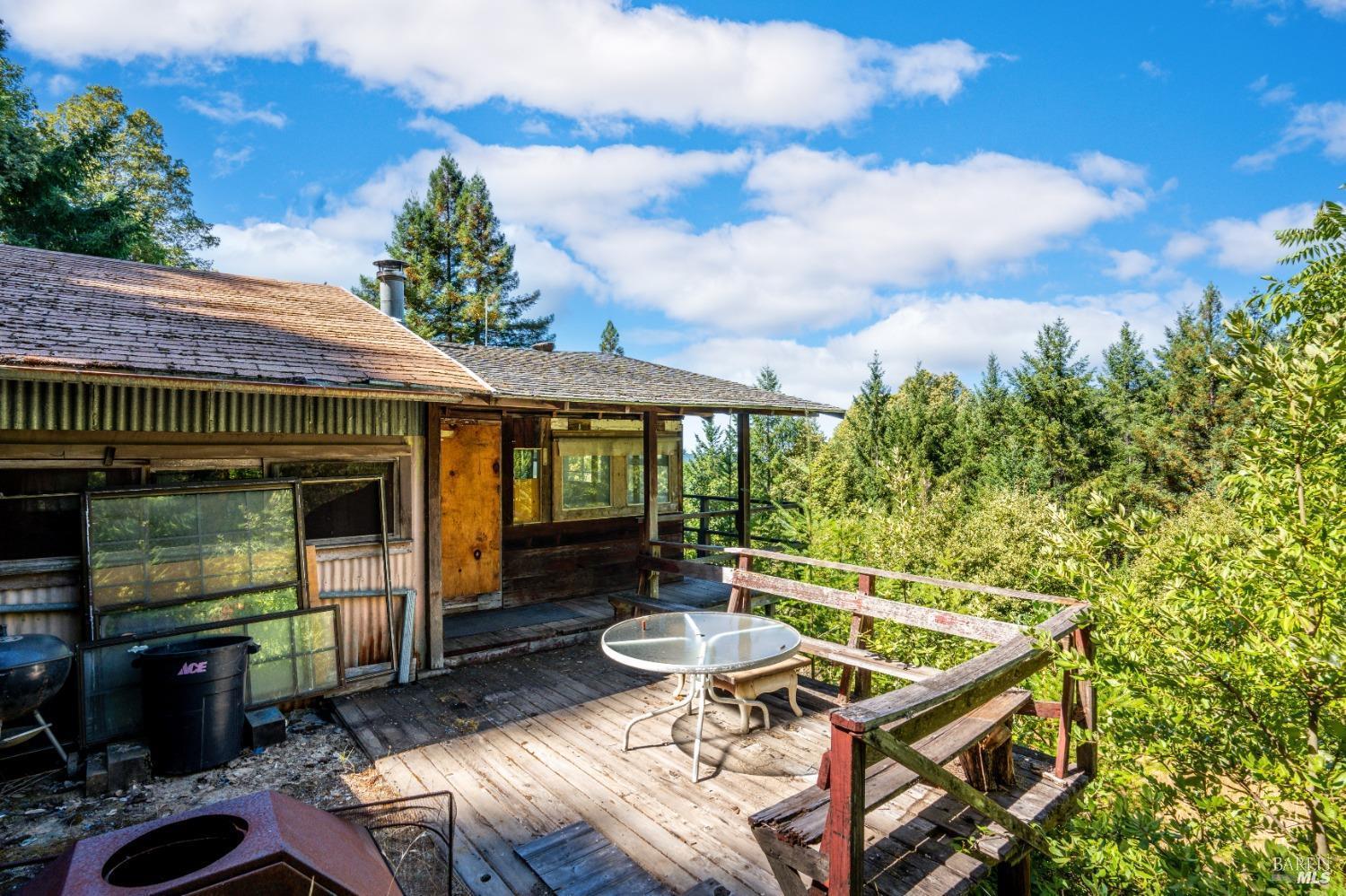 0 Low Gap Road Ukiah, CA 95482 - Photo 8 of 20 a view of a patio with table and chairs with wooden floor and fence