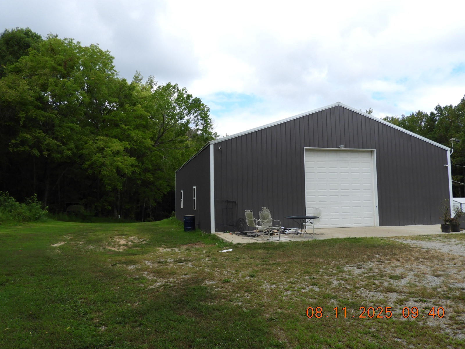1240 Johnson Branch Road Pulaski, TN 38478 - Photo 15 of 68 a backyard of a house with table and chairs