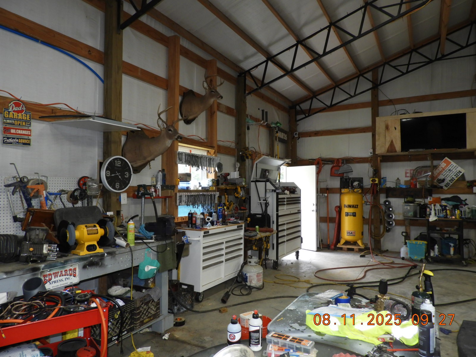 1240 Johnson Branch Road Pulaski, TN 38478 - Photo 38 of 68 a kitchen with lots of clutter and stainless steel appliances