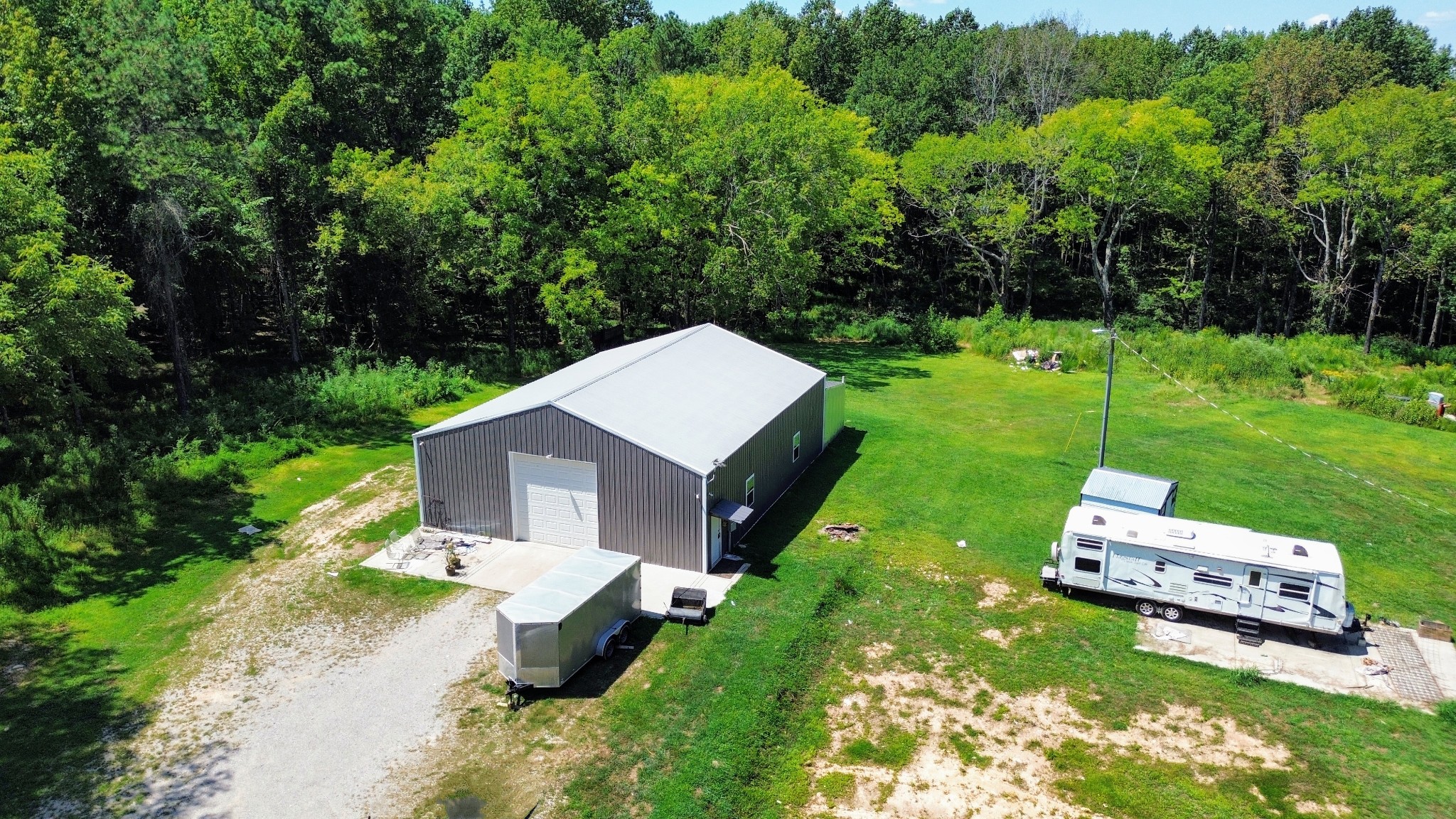 1240 Johnson Branch Road Pulaski, TN 38478 - Photo 5 of 68 a small garden is sitting in the grass