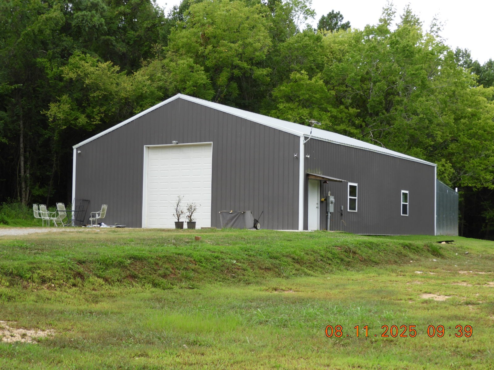 1240 Johnson Branch Road Pulaski, TN 38478 - Photo 8 of 68 a backyard of a house with lots of green space and outdoor seating
