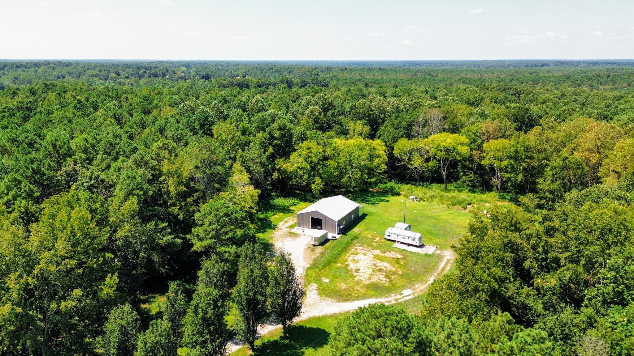 1240 Johnson Branch Road Pulaski, TN 38478 - Photo 9 of 68 a view of a lake in middle of green field